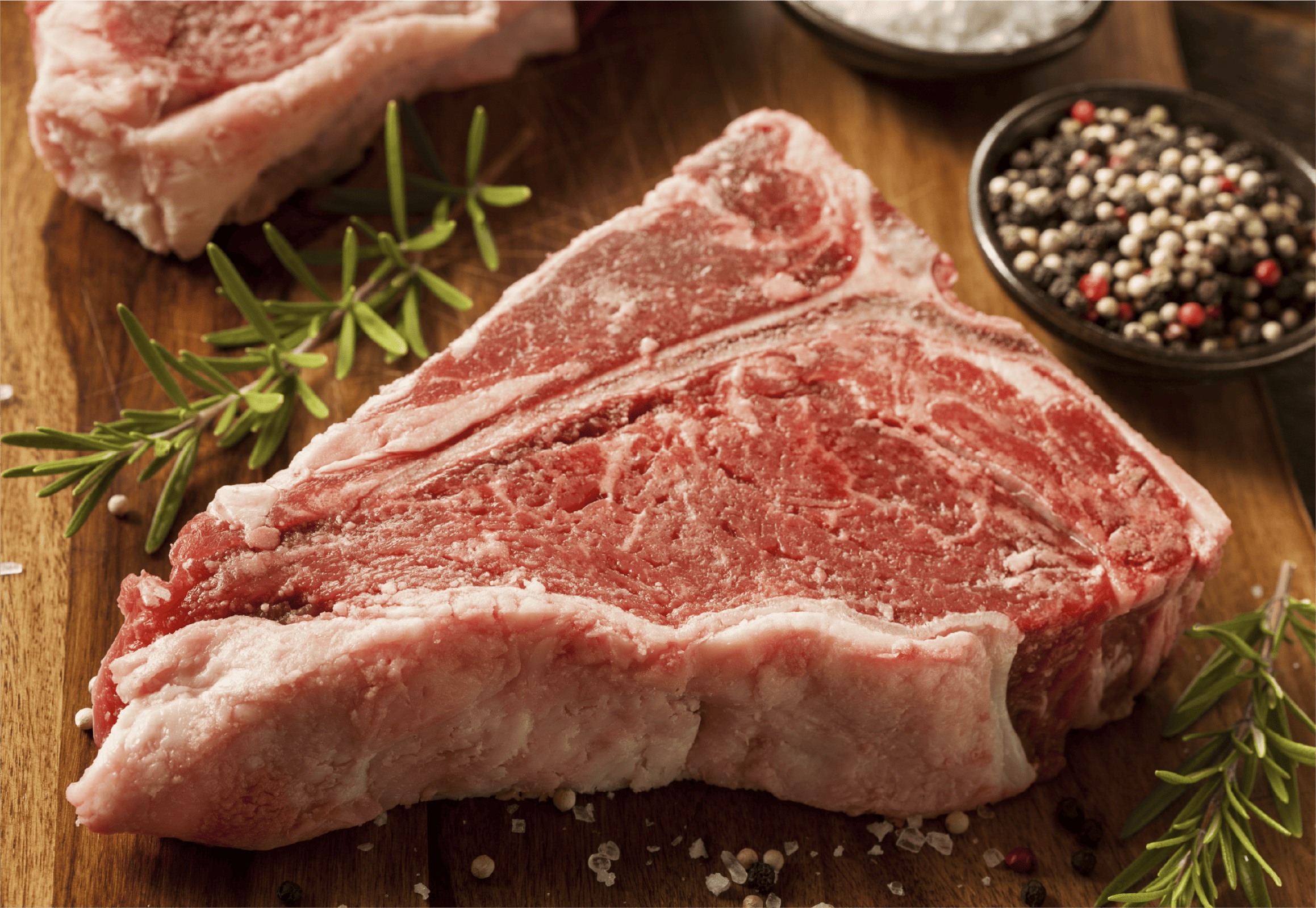 Raw T-Bone Steak with Herbs and Spices
